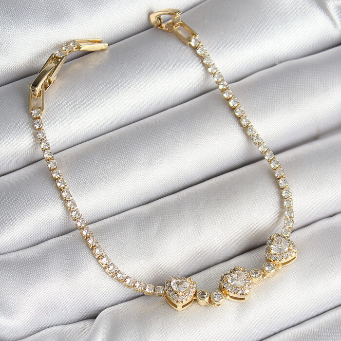 Pirinç Sıralı Kalp Figürlü Zirkon Taşlı Gold Renk Kadın Bileklik
