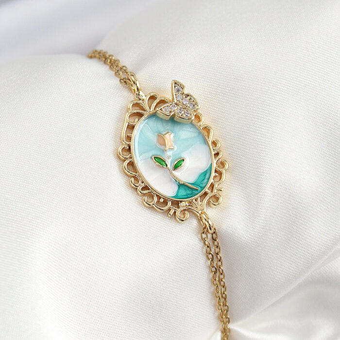 316L Çelik Zincir Mineli Sanatsal Portre Zirkon Taşlı Kelebek Detaylı Çiçek Model Gold Renk Kadın Bileklik