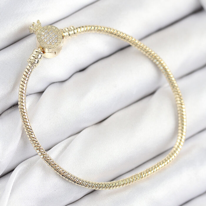 Pirinç Charm Zirkon Taşlı Taç Model Gold Renk Kadın Bileklik